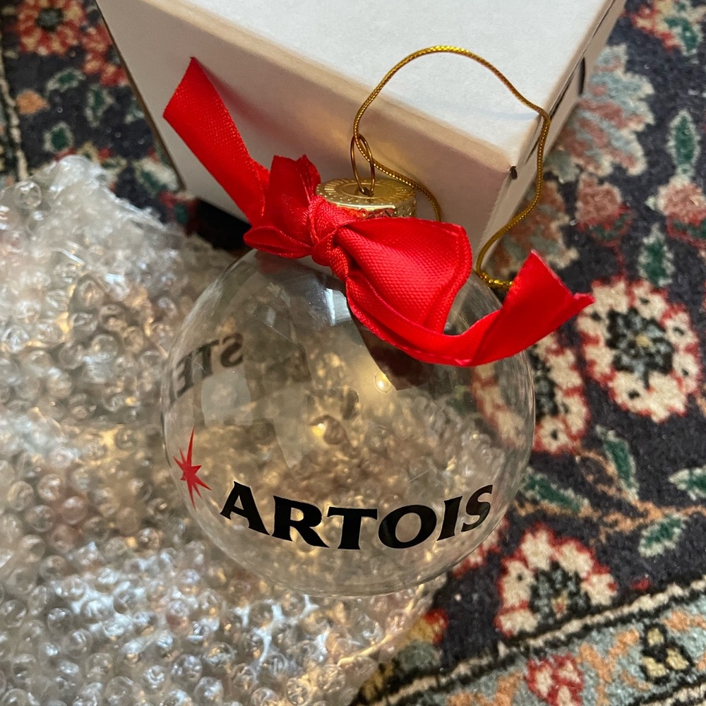 Stella Artois Glass Ornament with Red and Gold Accents